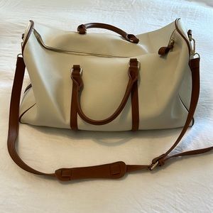 Cream and tan leather duffle bag
